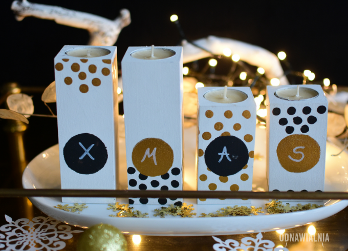 Świąteczne dekoracje – biel, czerń i złoto na świecznikach